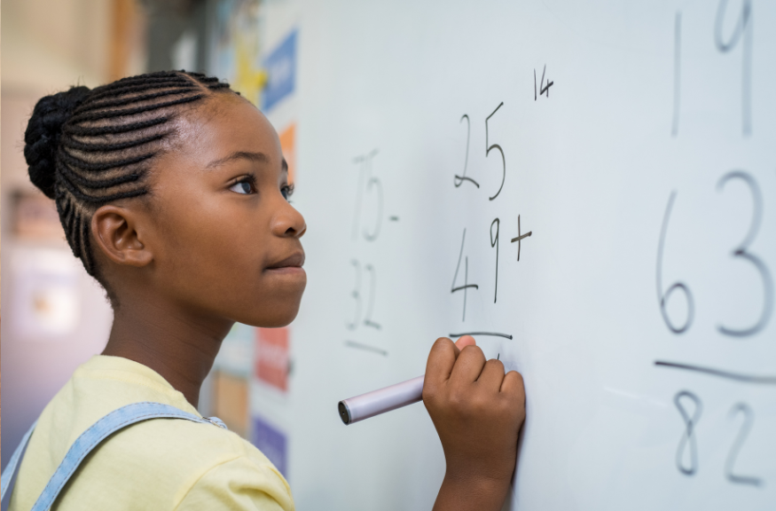 A photo of a young girl answering a math problem